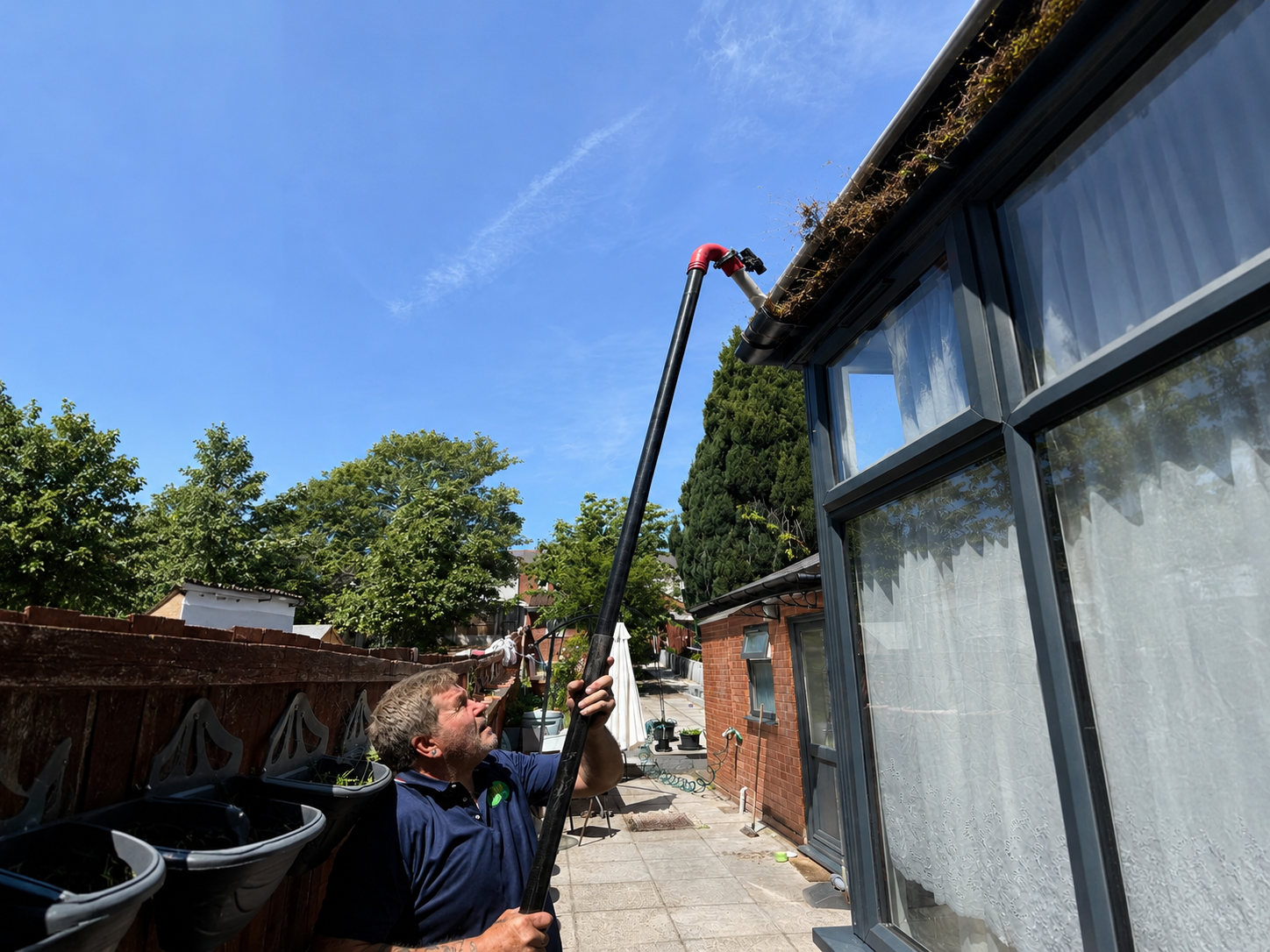Before gutter cleaning Ladywood B16 Birmingham — urban silt and debris compaction in blocked gutter channel